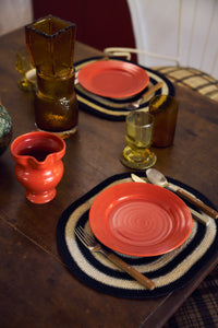 HKLIVING Farmhouse Ceramics small jug in red, filled and set on a laid table with amber glassware and terracotta plates