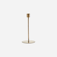 lightly shiney, tall and thin candle holder with a generous base from house doctor