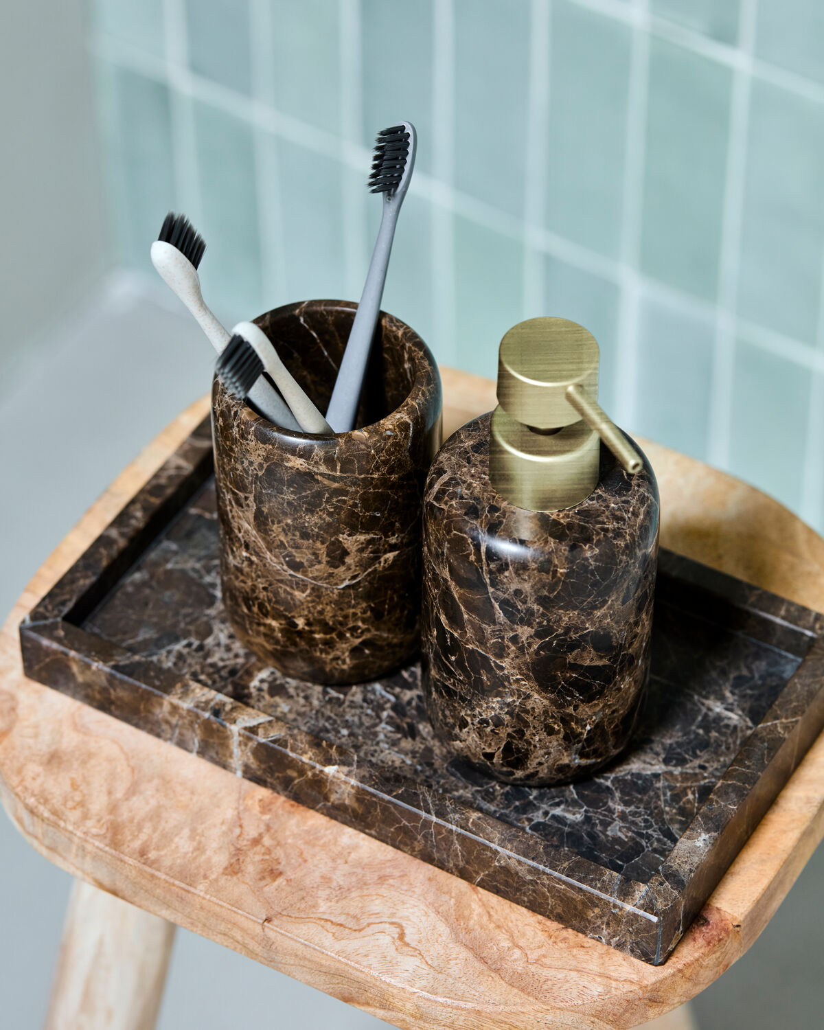 House Doctor Able marble tray styled in a bathroom with soap dispenser and toothbrush holder