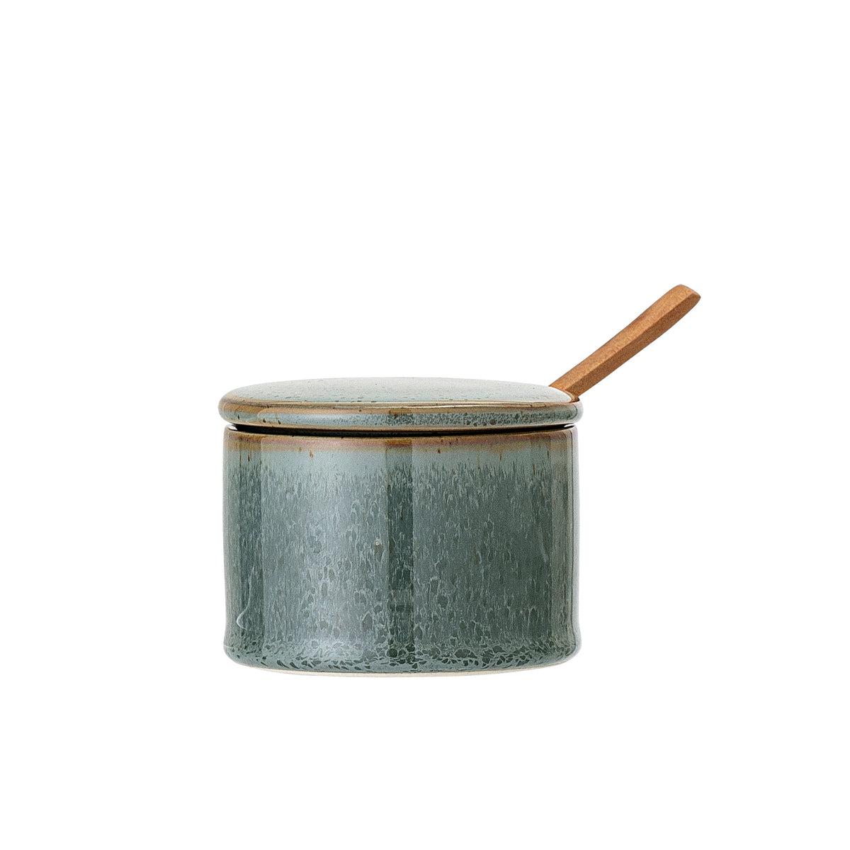 green stoneware pixie jar with lid and wooden spoon inserted