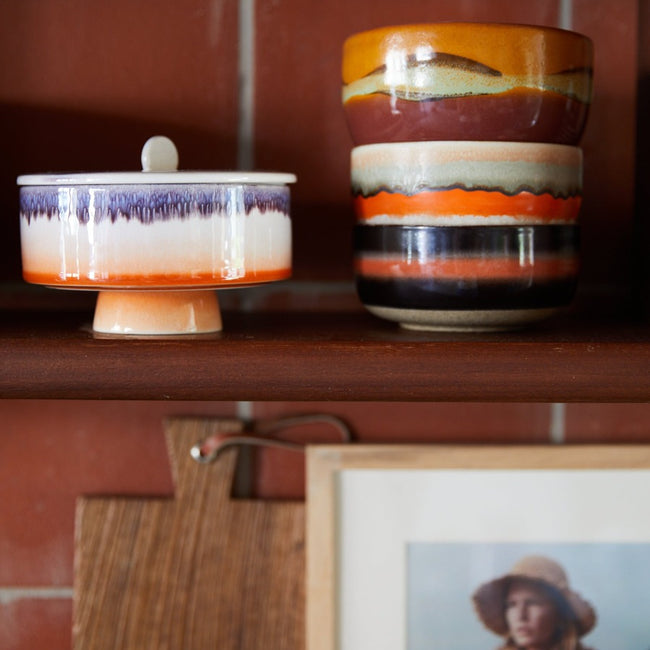 mauve bonbon jar on a kitchen shelf with other colourful pieces from the 70s collection