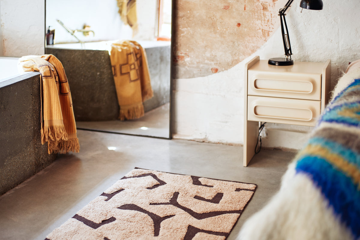 Lifestyle shot of the cream Space Nightstand by HKLIVING styled in a room setting