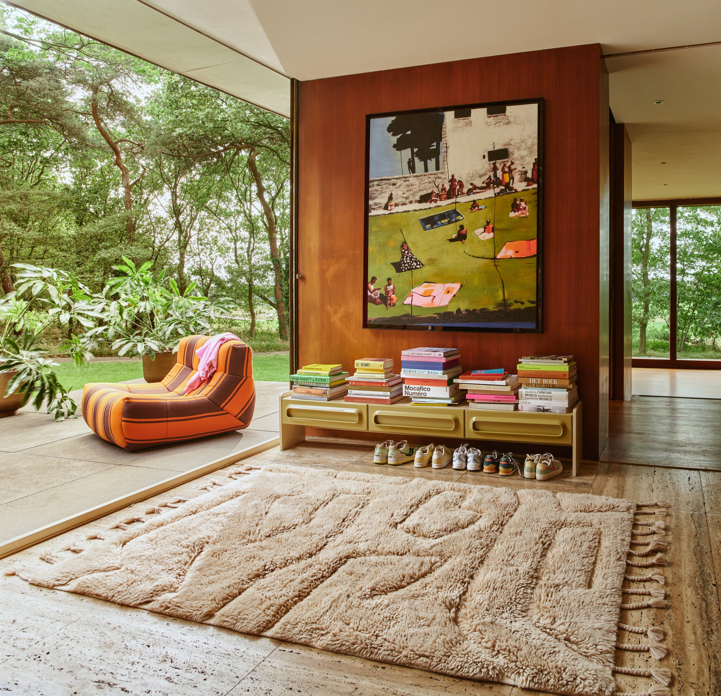 HKLIVING wool rug limitless in cream styled in a living room with a green velvet sofa and wooden slatted coffee table