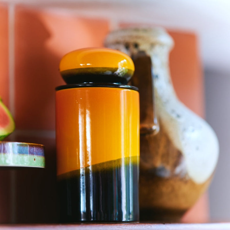 storage jar looking like a golden setting sun creating dark shadows accross hillscape is the colouring of this item from hkliving