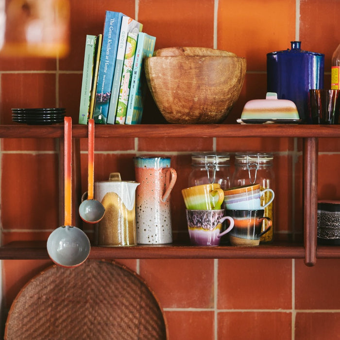 mix of colourful fun 70s hkliving crockery on shelves in kitchen