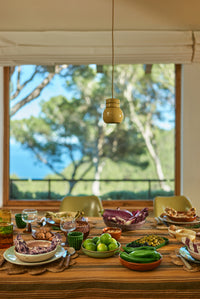 ustic dinner table featuring HKLIVING 70s ceramics in green