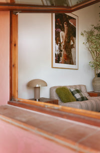 HKLIVING mocha lounge table lamp reflected in a mirror, styled beside a framed print and grey sofa with green cushions