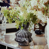 marble look black and white vase hand made mouth blown glass vase with plants and flowers