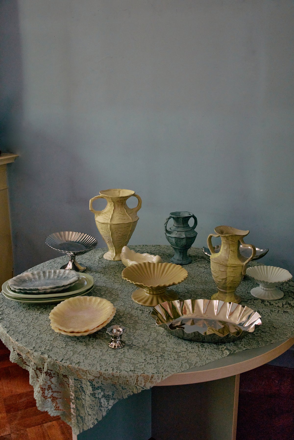 Table set with ceramic jugs, plates and the Medium HKLIVING chrome tray on a soft green tablecloth