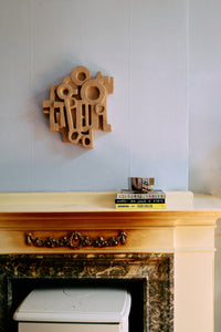 HKLIVING large brutalist terracotta wall sculpture styled in an interior