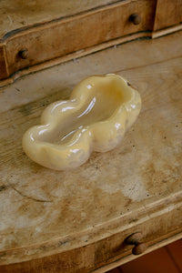 The HKLIVING oyster glass bowl displayed on a weathered wooden dresser, styled with a small wooden dish beside it