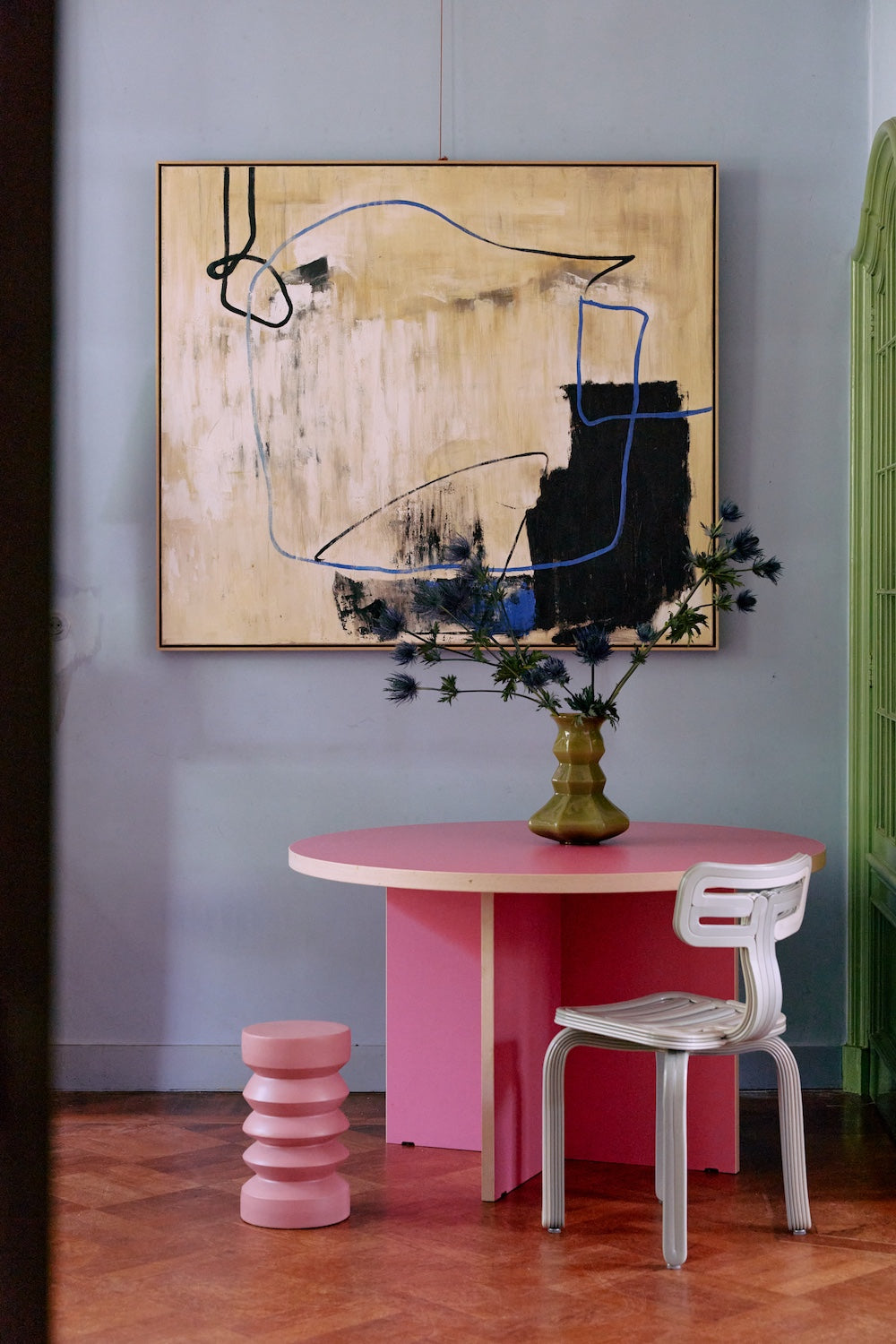 Easy Elan framed artwork by HKLIVING hung above a pink dining table and chair