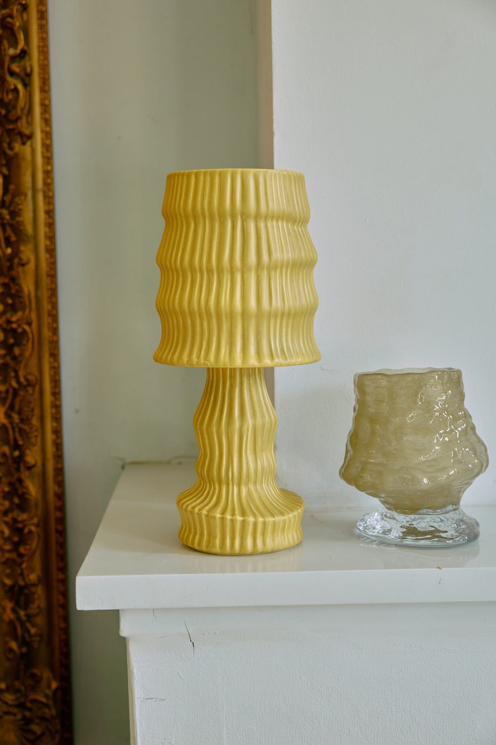 HKLIVING ochre ribbed ceramic table lamp styled on a shelf beside a ribbed amber glass vase and gilt-framed mirror