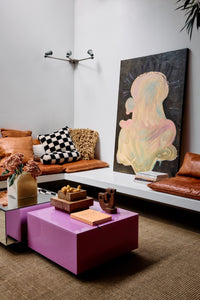 Pappagallo wall art by Gabriella Ferrero for HKLIVING leaning against a wall in a colourful living room corner