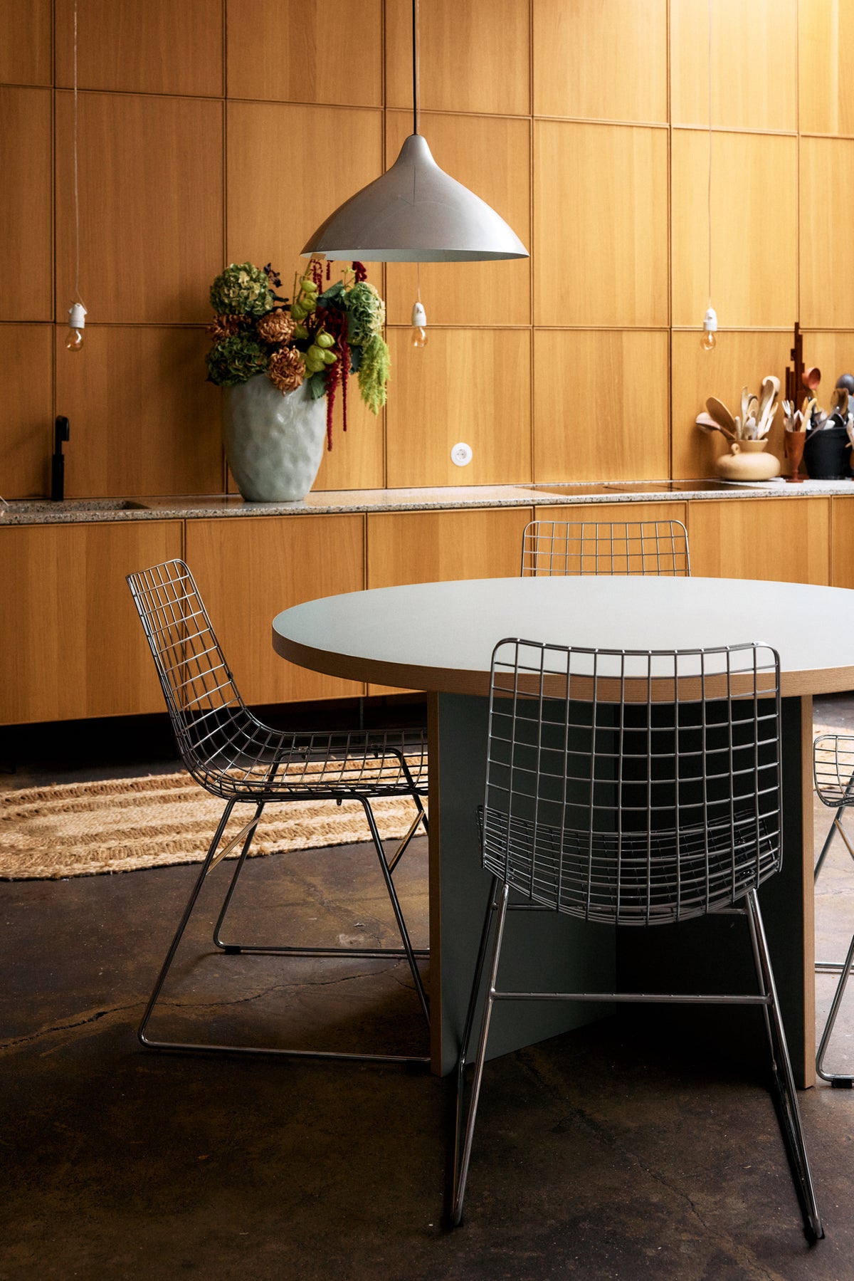 HKLIVING 130cm round dining table styled in a modern open-plan kitchen with calm design-led colour
