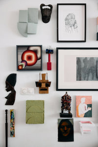 Sage green Levels wall sculpture displayed as part of an eclectic gallery wall