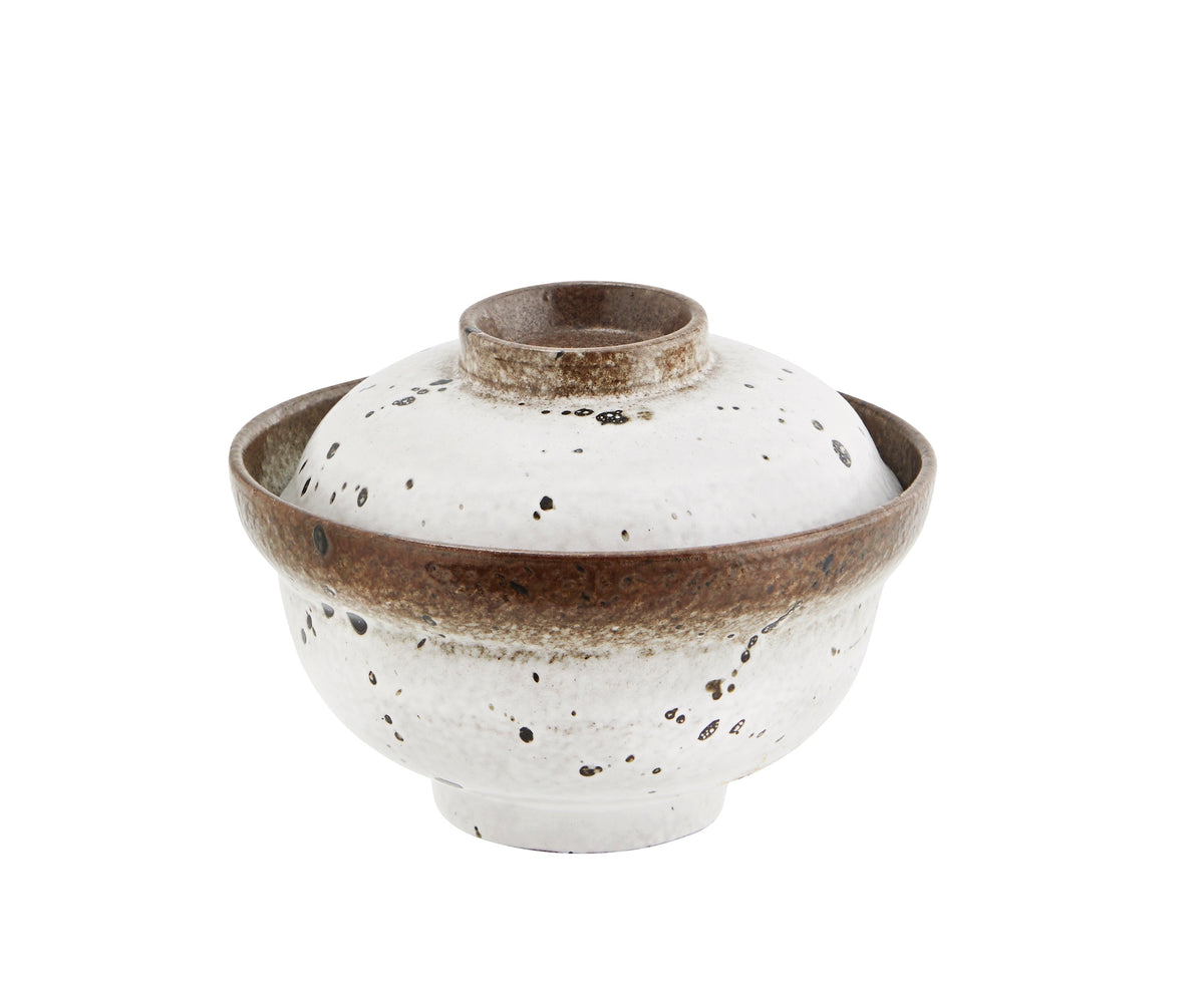 stoneware bowl with lid closed featuring speckled reactive glaze
