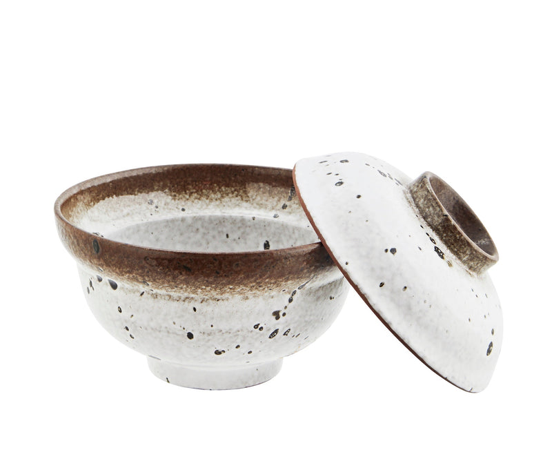 stoneware bowl with reactive glaze and matching lid shown open
