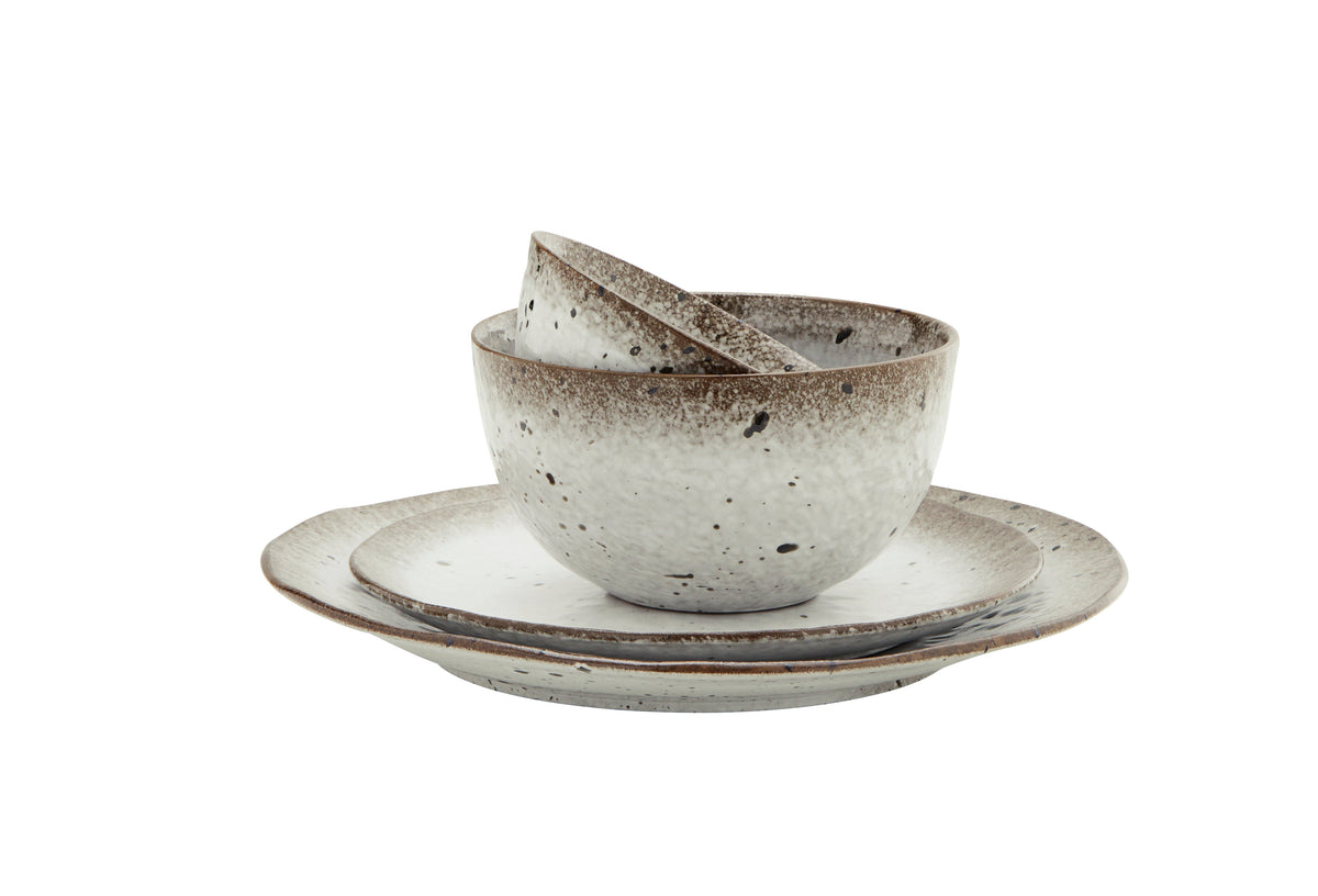 small reactive glaze stoneware bowl in white and brown speckle finish
