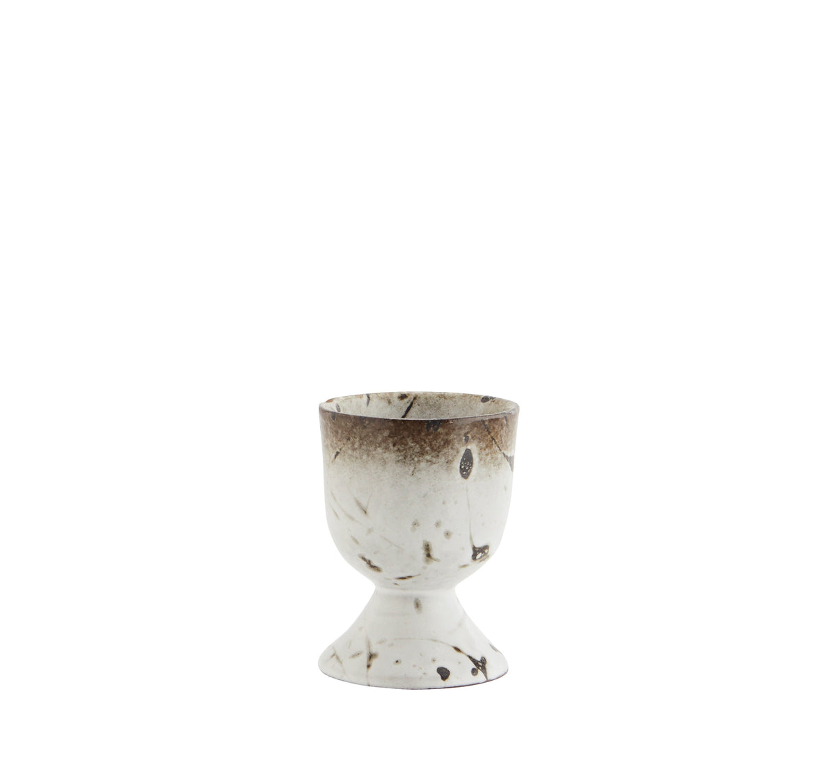 stoneware egg cup with white glaze and brown speckled detailing
