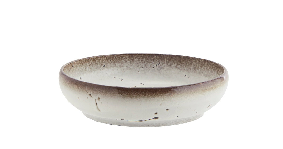 large reactive glaze stoneware serving bowl in white and brown
