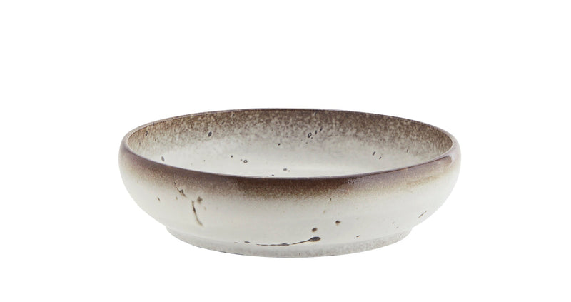 large reactive glaze stoneware serving bowl in white and brown
