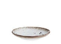 side view of speckled stoneware cake plate showing reactive glaze edge
