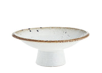 beige and brown speckled stoneware pedestal dish with reactive glaze finish
