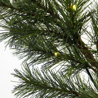 close up of the garland showing a pine needles and a cople of the small LED lights