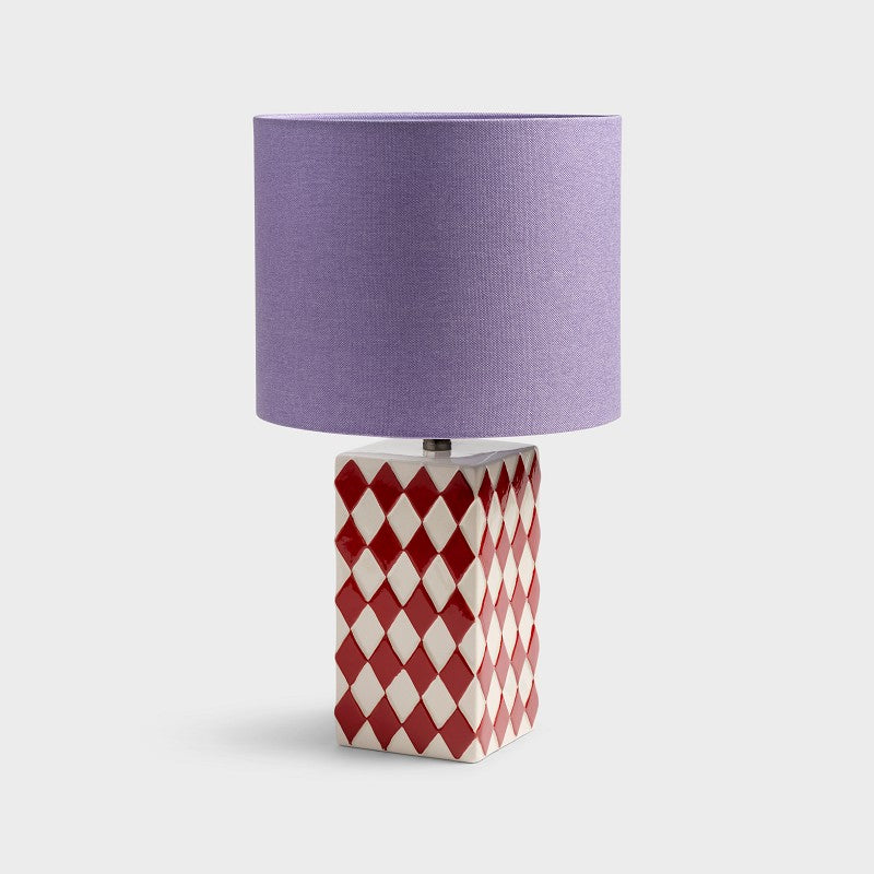 cut-out image of &klevering grid ceramic table lamp in red cream with purple lampshade
