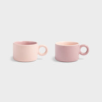 Product image of the Chiquito pink mug set of two with round handles.