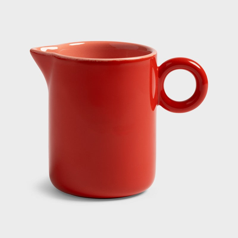red stoneware chiquito milk jug with circular handle by &klevering amsterdam