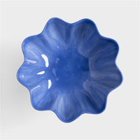 overhead view of the blue sun bowl by &k showing scalloped design and glossy glaze