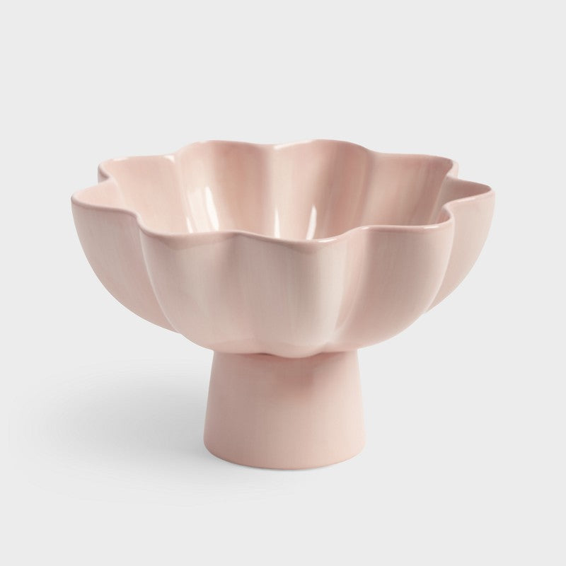 pink pedestal sun bowl in glossy stoneware with wavy rim
