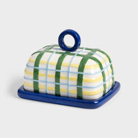 ceramic butter dish with blue base and plaid hand-painted lid
