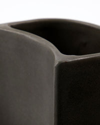Close-up of the matt dark grey glaze on the Regular Meraki Datura brush and soap holder