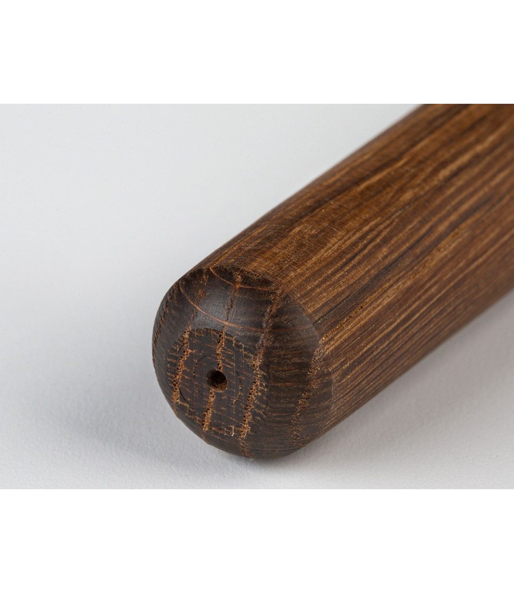Close-up of a Smoked Oak Le Feu Dome Leg