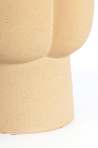 sculptural curved detailing on the junto ceramic side table in sand