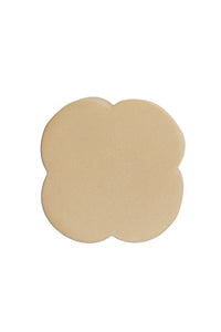 ase view of junto side table showing protective pads and ceramic structure