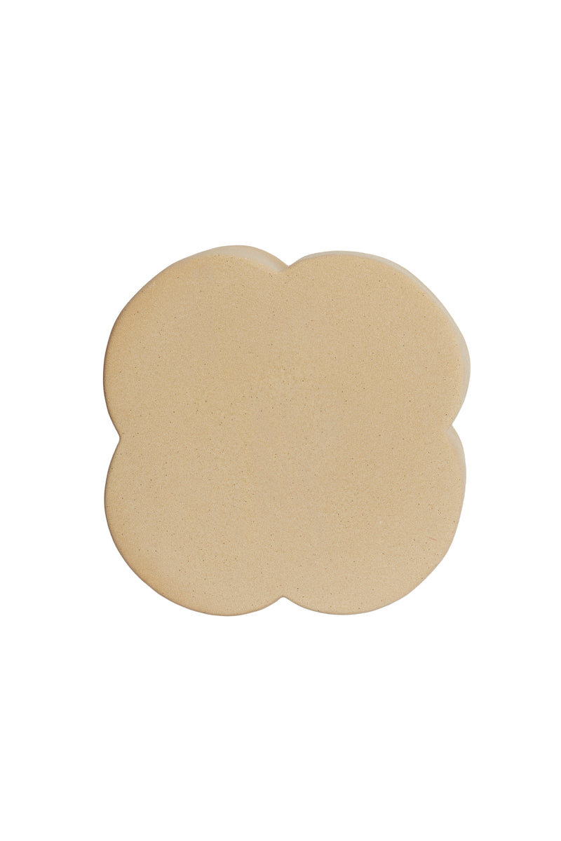 ase view of junto side table showing protective pads and ceramic structure