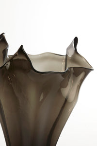 close-up of wavy sculptural edge of dark grey aiora glass vase
