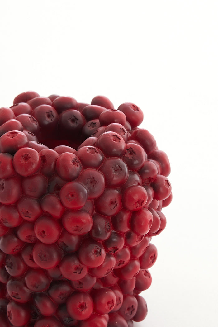 close-up of burgundy berries decorative vase showing sculptural clustered texture
