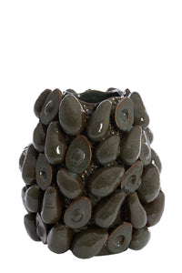 avocado vase styled on a dining table with candles and décor in a modern interior