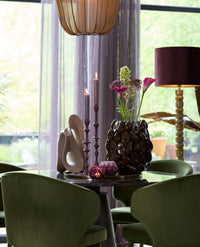 detailed side view of raised avocado motifs on ceramic vase