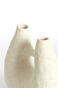 close up of katha sculptural vase showing matte cream texture and organic curves
