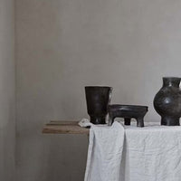 sideboard with a few decorative pieces including the handmade balck idris bowl from olsson and jensen of sweden