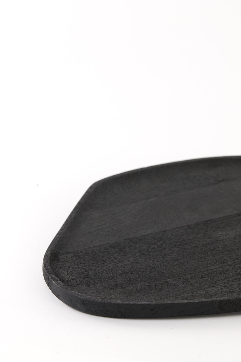 close-up of matte black acacia wood dish showing grain and soft rim
