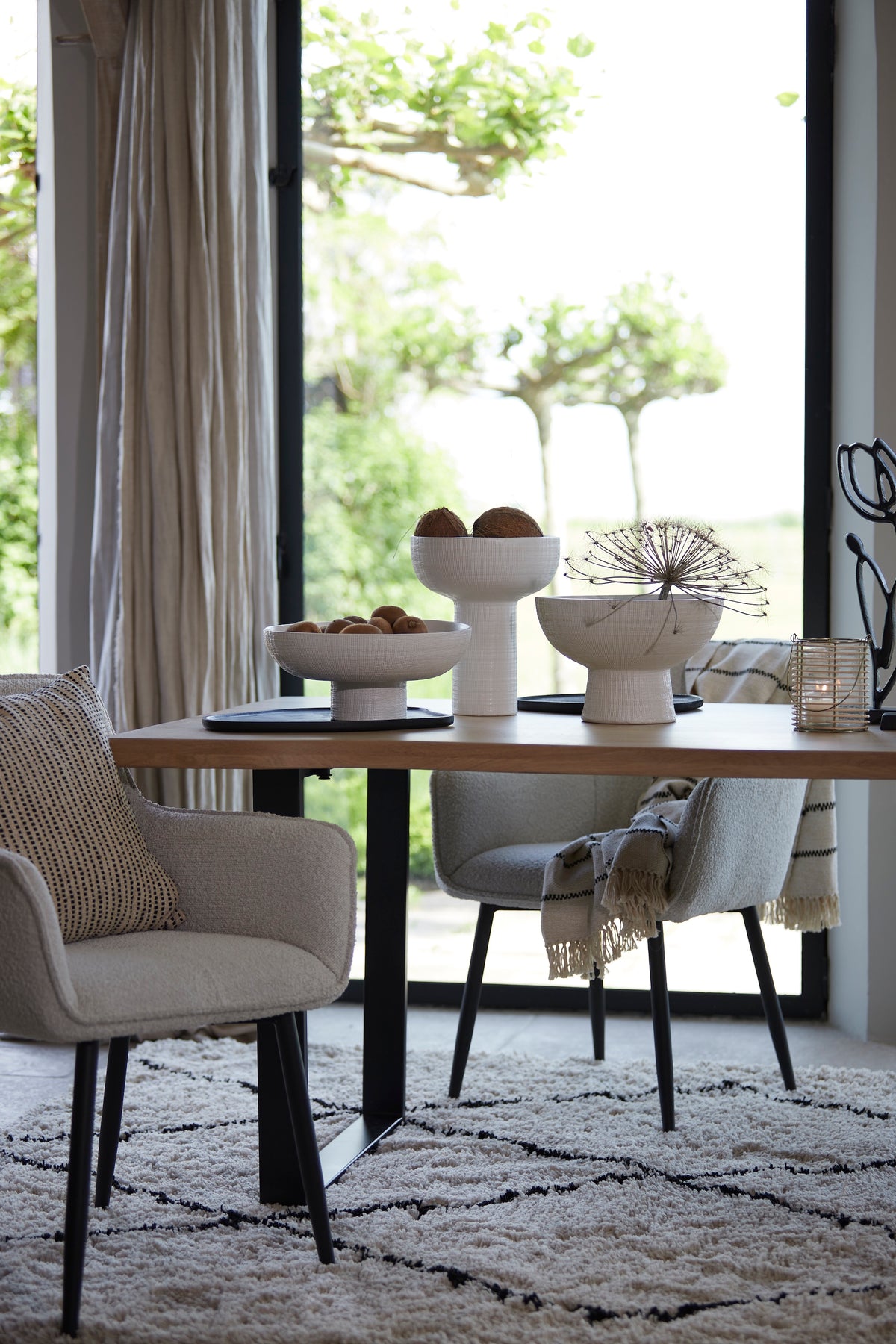 black wooden styling tray used under ceramic bowls in modern dining room
