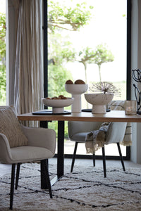black wooden styling tray used under ceramic bowls in modern dining room
