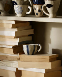 GOGI cup by Nordal styled on a linen tablecloth with tea, among other Atelier FORMA cups